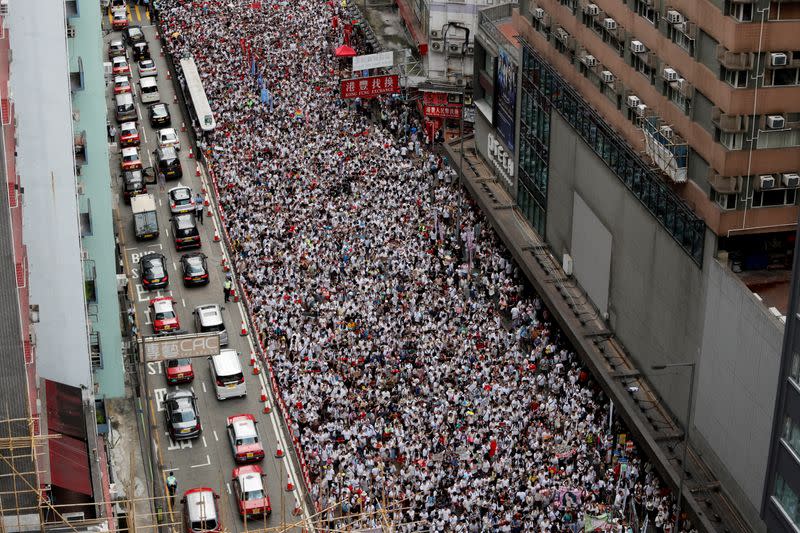 FILE PHOTO: Anti-government protesters attend a protest to demand authorities scrap a proposed extradition bill with China, in Hong Kong
