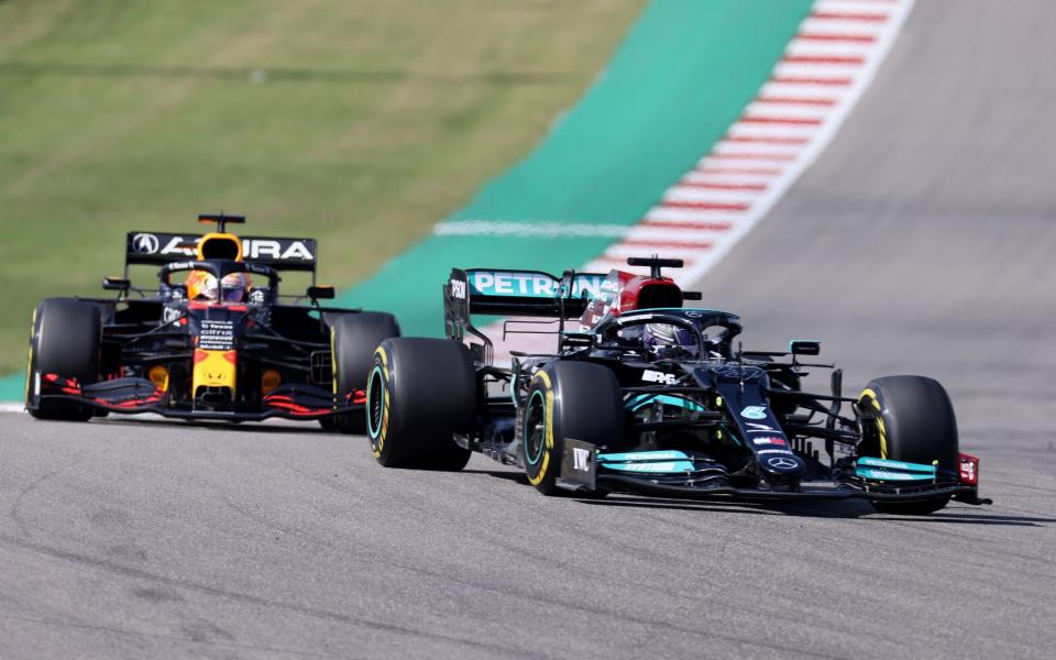 Formula One F1 - United States Grand Prix - Circuit of the Americas, Austin, Texas, U.S. - October 24, 2021 Mercedes' Lewis Hamilton in action with Red Bull's Max Verstappen during the race - REUTERS 