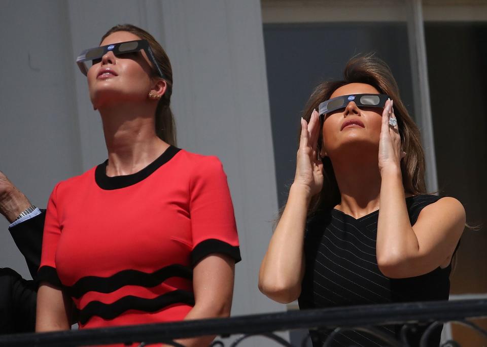 <p>To watch the solar eclipse on the White House balcony, Melania paired a slim-fitting black dress with a pair of protective eye glasses.</p>