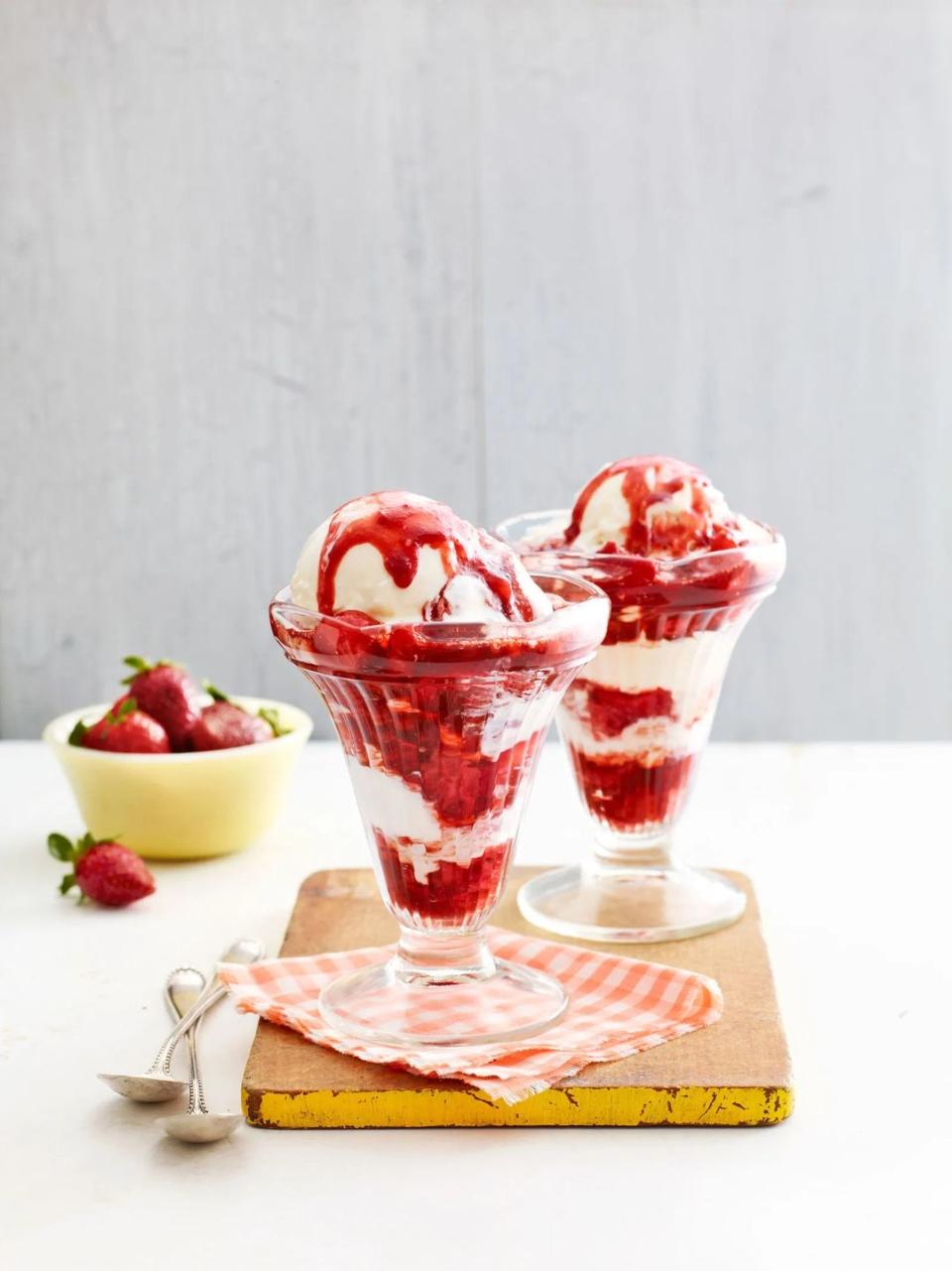 brown sugar balsamic strawberry sauce over vanilla ice cream in sundae glasses