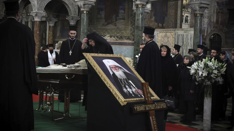 A Bulgarian Orthodox nun pays her last respects to Bulgarian patriarch Neophyte at the Alexander Nevsky Cathedral in Sofia, Friday, March 15, 2024. National mourning was declared by the Bulgarian government on March 15 and 16 to honour Patriarch Neophyte of Bulgaria. Neophyte who was the first elected head of the Orthodox Church in the post-communist Balkan country, died at a hospital in Sofia on March 13. He was 78. (AP Photo/Valentina Petrova)