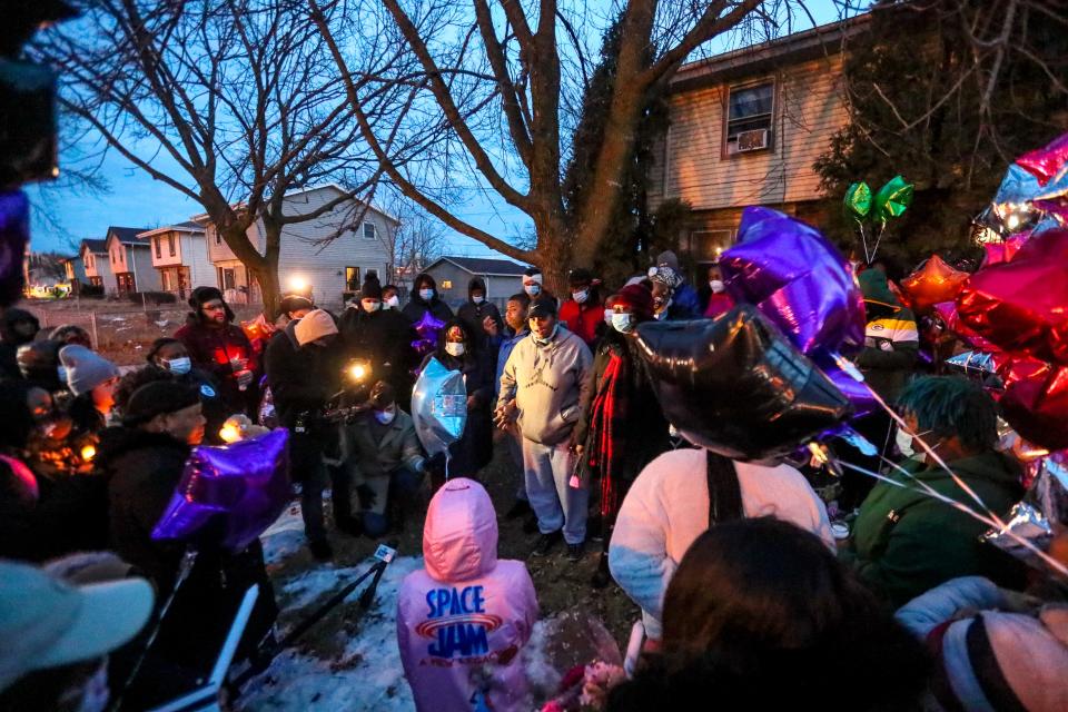 Tiana Huddleston's friends and family gather to mourn her death during a vigil Tuesday, Jan. 18, 2022, near 18th Street and Highland Avenue for the 8-year-old who was killed Saturday, Jan. 15, 2022. There is a 47-year-old man arrested in the incident.