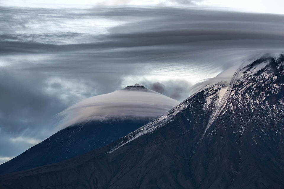 Stunning images capture ‘UFO’ clouds surrounding volcano 