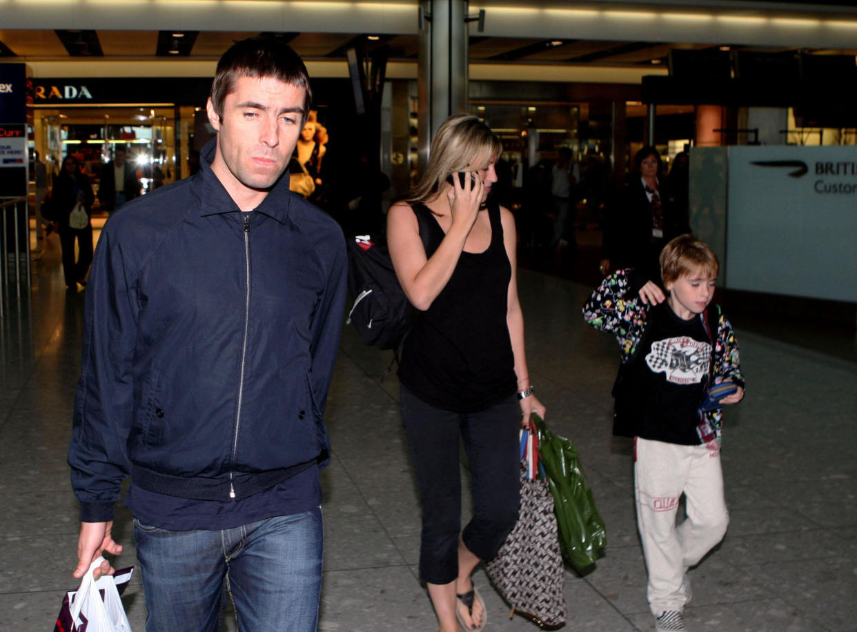 Liam Gallagher with his wife Nicole Appleton and son Gene walk through Heathrow Airport in Middlesex.