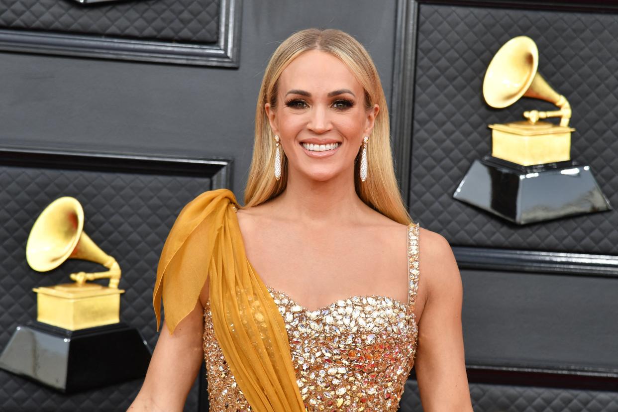 US singer/songwriter Carrie Underwood arrives for the 64th Annual Grammy Awards at the MGM Grand Garden Arena in Las Vegas on April 3, 2022. (Photo by ANGELA  WEISS / AFP) (Photo by ANGELA  WEISS/AFP via Getty Images)