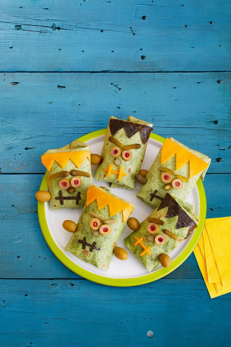 <p>These wraps come to life with sliced Cheddar, olives and cornichon pickles that form a monstrous face!</p><p>Get the recipe from <a href="https://www.womansday.com/food-recipes/a33564111/monster-wraps-recipe/" rel="nofollow noopener" target="_blank" data-ylk="slk:Woman's Day;elm:context_link;itc:0;sec:content-canvas" class="link ">Woman's Day</a>.</p>