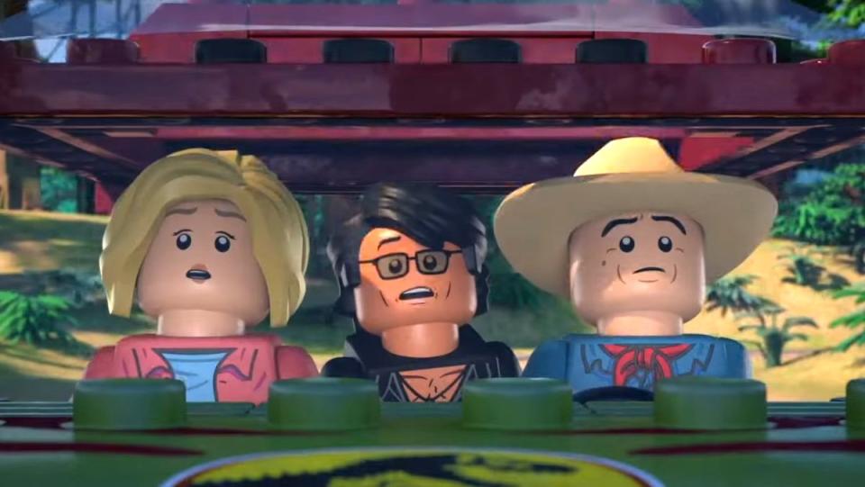 Ellie, Ian, and Alan look up from their Jeep in LEGO Jurassic Park