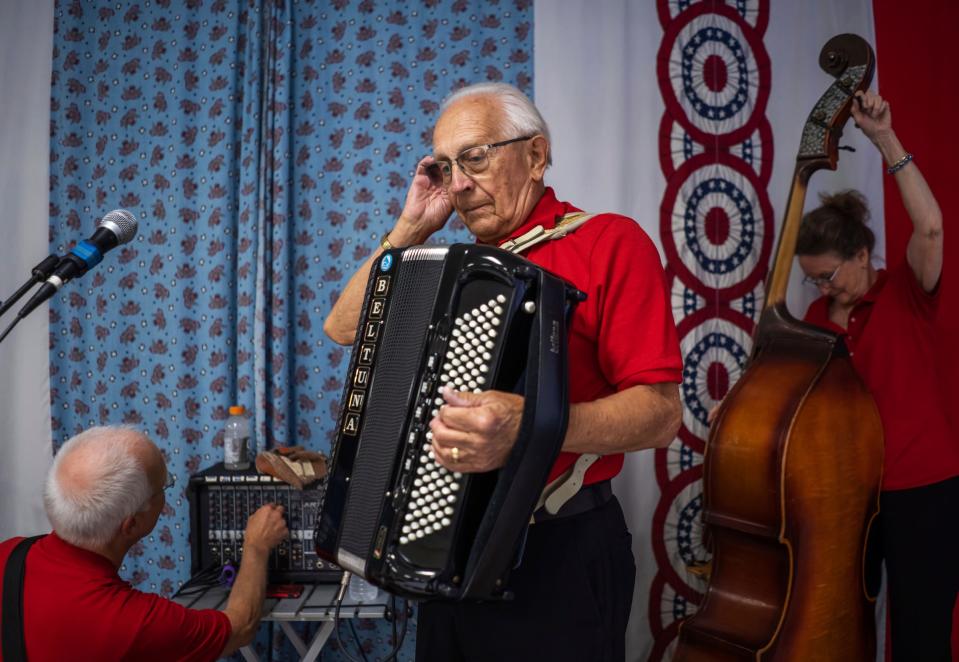 Jim Enrietti, center, of Delton, gets ready to start the show as his wife, Teri Enrietti, of Delton, and John Peiffer, of College Park, Maryland, get their instruments ready to play as The World's Most Dangerous Polka Band during the weekly polka dance held at the South Range Eagles Club in South Range on Sunday, July 23, 2023, in Michigan's Upper Peninsula.