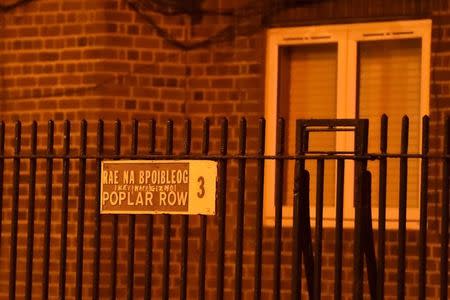 A street sign for Poplar Row is seen, where police officers are attending to the scene of a shooting, in Dublin, Ireland February 8, 2016. REUTERS/Clodagh Kilcoyne