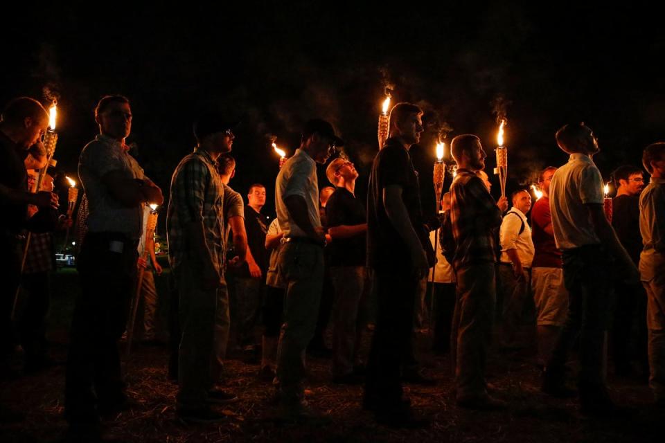 Multiple white nationalist groups march with torches through the University of Virginia campus on Aug. 11, 2017, in Charlottesville. On Wednesday, Donald Trump said that the rally was ‘peanuts’ compared to pro-Palestine campus demonstrations (USA TODAY NETWORK)