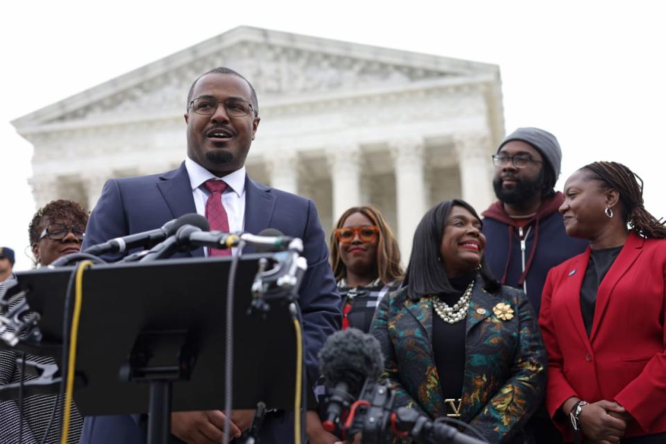 Deuel Ross speaks to members of the press after the oral argument of the Merrill v. Milligan case at the U.S. Supreme Court in 2022.