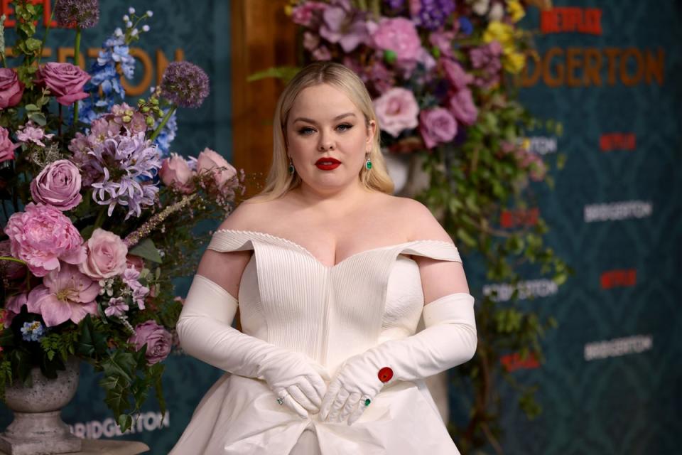 Nicola Coughlan, wearing a red pin which represents a call for a ceasefire in Gaza, at Bridgerton's New York premiere (Getty Images for Netflix)