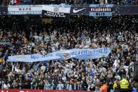 Manchester City fans hold up a banner before the English Premier League soccer match between Manchester City and West Ham at the Etihad Stadium in Manchester, England, Sunday May 11, 2014. (AP Photo/Jon Super)