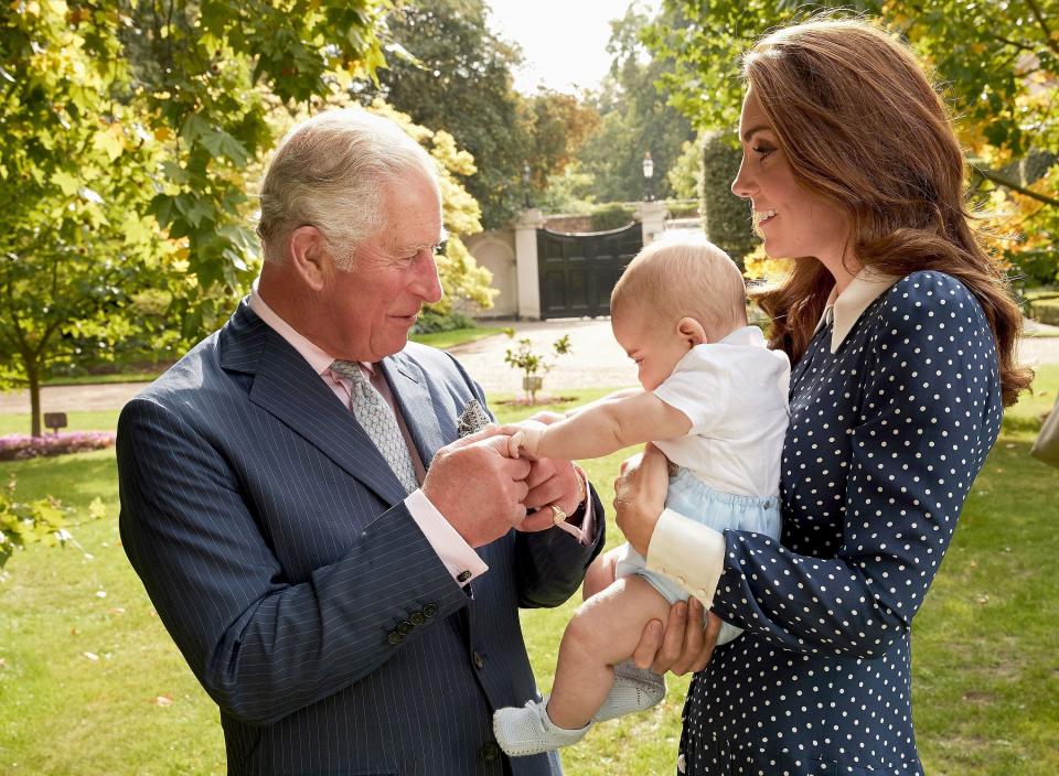 Prince Charles shares a moment with Prince Louis and the Duchess of Cambridge during the family photo shoot.