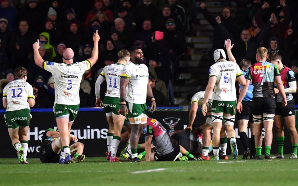 London Irish players celebrate after Ben White scores a try at Twickenham Stoop - PA