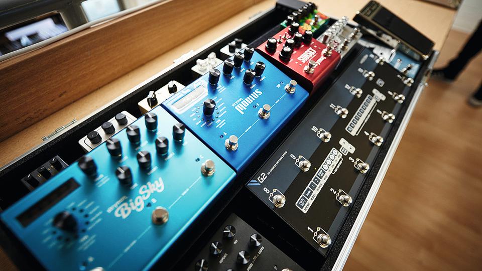 A side-on view of a well organised pedalboard