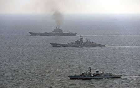 HMS St Albans (front) monitors Russian warships Pyotr Velikiy and the Admiral Kuznetsov (rear) as they pass close to UK territorial waters, in this photograph released in London on January 25, 2017. Ministry of Defence/Crown Copyright 2017/Handout via REUTERS