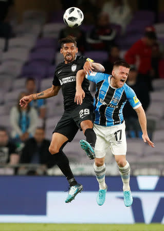 Soccer Football - FIFA Club World Cup Semi Final - Gremio FBPA vs CF Pachuca - Hazza Bin Zayed Stadium, Al Ain City, United Arab Emirates - December 12, 2017 Gremio’s Ramiro in action with Pachuca's Franco Jara REUTERS/Amr Abdallah Dalsh