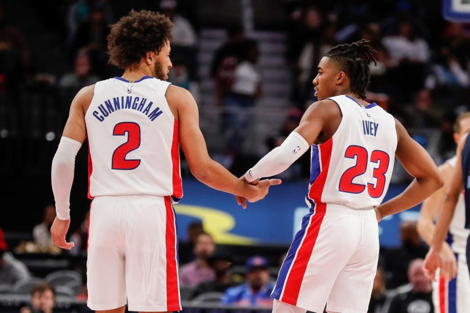 Pistons guard Cade Cunningham talks to guard Jaden Ivey during the first half of a preseason game at the Little Caesars Arena on Thursday, Oct. 13, 2022.