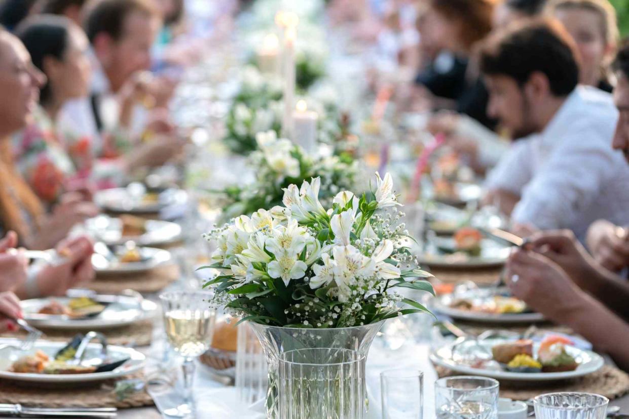 <p>Getty</p> A stock image of a wedding reception meal