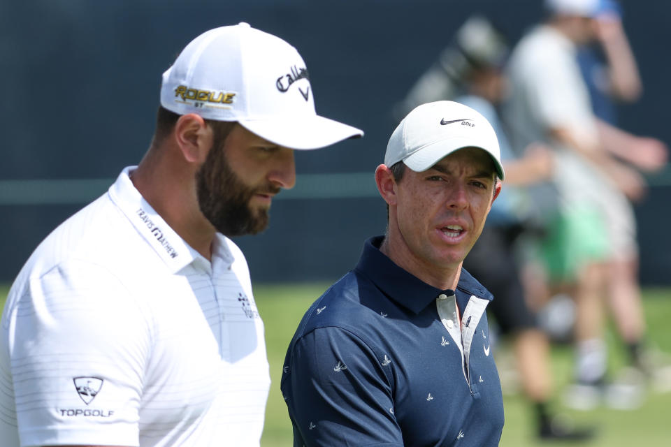 BROOKLINE, MASSACHUSETTS - JUNE 13: (L-R) Jon Rahm of Spain and Rory McIlroy of Northern Ireland walk the second hole during a practice round ahead of the 2022 US Open at The Country Club on June 13, 2022 in Brookline, Massachusetts.  (Photo by Warren Little/Getty Images)