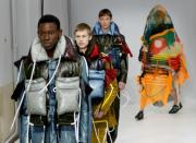 Voyage into the future: Models walk the catwalk in British designer Craig Brown's debut Paris show