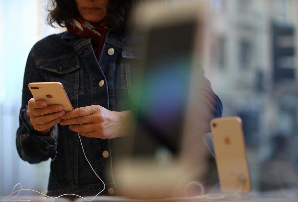 A customer inspects the new Apple iPhone 8 at an Apple Store on September 22, 2017 in San Francisco, California: Justin Sullivan/Getty Images