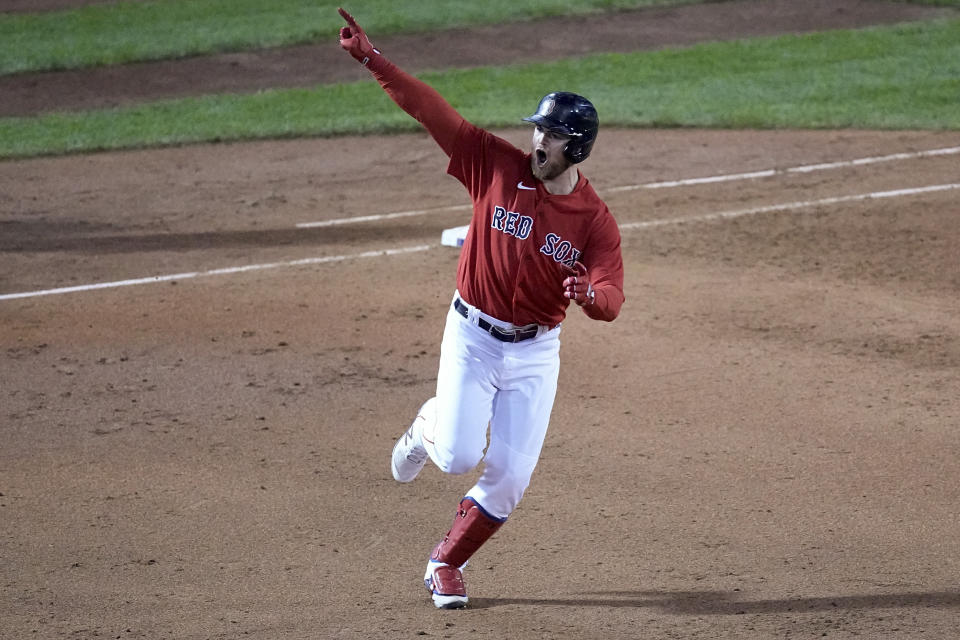 Boston Red Sox's Christian Arroyo celebrates after a two-run home run against the Houston Astros during the third inning in Game 3 of baseball's American League Championship Series Monday, Oct. 18, 2021, in Boston. (AP Photo/Robert F. Bukaty)