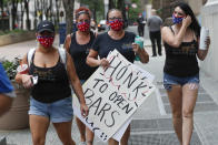 Staff members from Kosbar, a bar in Coraopolis, Pa. a town west of Pittsburgh, join with other service industry workers and supporters to protest in front of Allegheny County offices, Thursday, July 2, 2020, in Pittsburgh. They are protesting that the county ordered bars closed and stopping the sale of on-site alcohol consumption in restaurants on Sunday, June 28, with enforcement to start on July 1 after reported cases of COVID-19 went up drastically. (AP Photo/Keith Srakocic)