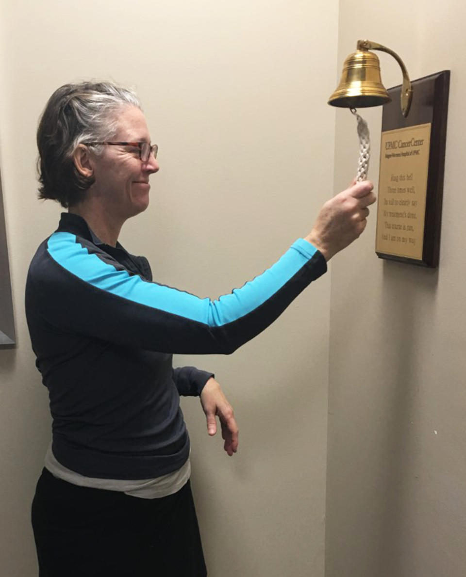 Brown rings a bell to mark the end of her radiation treatment. (Courtesy Theresa Brown)