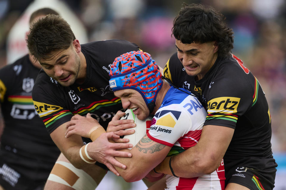 Kalyn Ponga tackled.