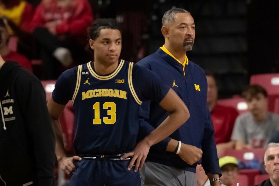 Michigan Wolverines head coach Juwan Howard  stands next to guard Jett Howard (13) before the start of the game against the Maryland Terrapins at Xfinity Center.