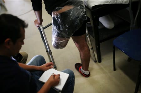 Migrants who lost legs attend a rehabilitation program