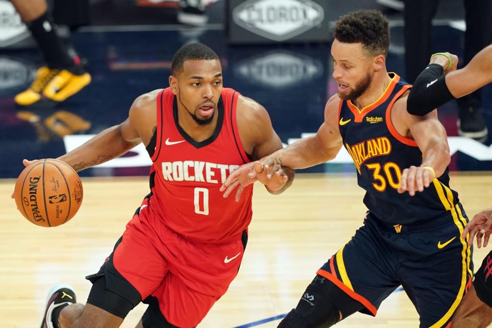 The Houston Rockets' Sterling Brown, left, working against Golden State Warriors guard Stephen Curry (30) during and April 10 game, was assaulted Sunday night in Miami.