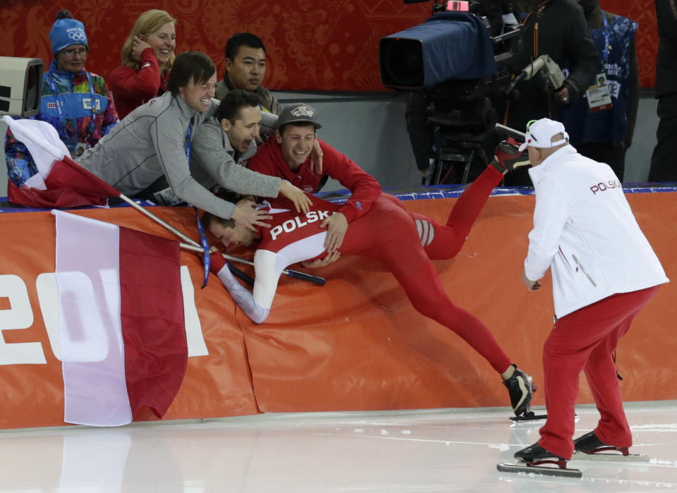 Gold medallist Poland's Zbigniew Brodka celebrates with supporters after the men's 1,500-meter speedskating race at the Adler Arena Skating Center during the 2014 Winter Olympics in in Sochi, Russia, Saturday, Feb. 15, 2014. (AP Photo/Matt Dunham)