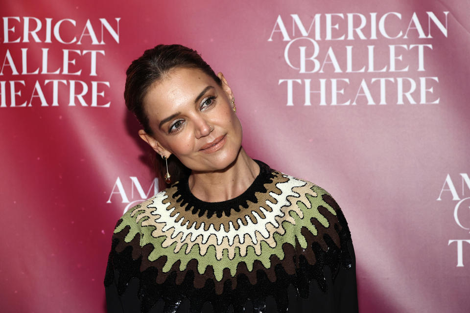 Katie Holmes poses in a stylish patterned dress at the American Ballet Theatre event