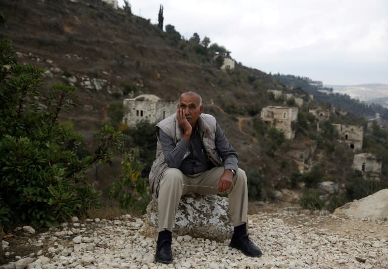 Yacoub Odeh, a 77-year-old Palestinian, sits by old houses in the ghost village of Lifta, whose Palestinian inhabitants fled during fighting in the 1948 war surrounding the creation of Israel