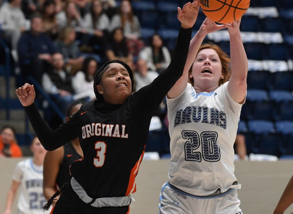 Bartlesville High School's Adrianne Flick (20) grabs a rebound against Putnam City in Bartlesville on Jan. 30, 2024.