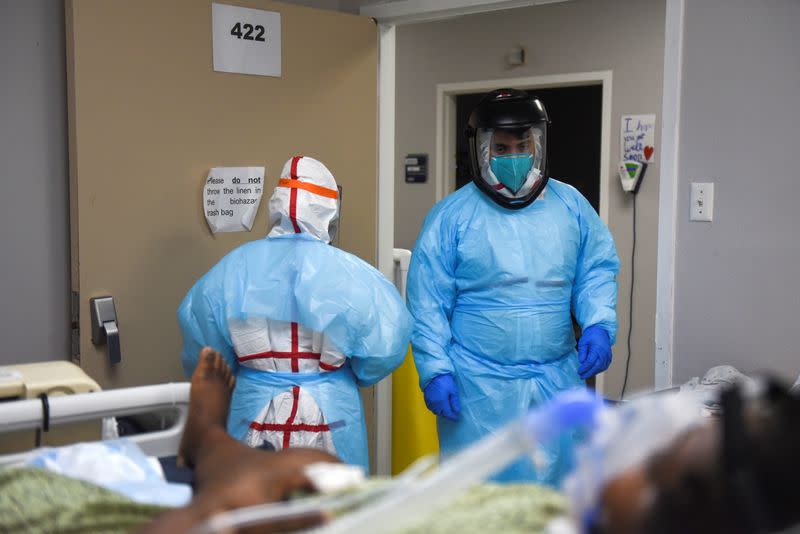 FILE PHOTO: Healthcare workers treat COVID-19 patients in Houston