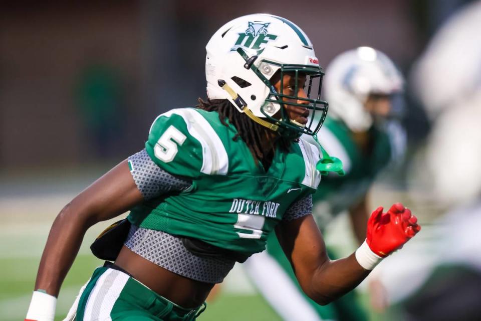 Dutch Fork Silver Foxes defensive back Tyler Jones (5) warms up before the game against the Weddington Warriors at Dutch Fork High School Friday, Sept. 22, 2023.