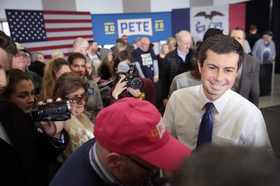 Pete Buttigieg (in white) campaigns in Iowa | Scott Olson/Getty