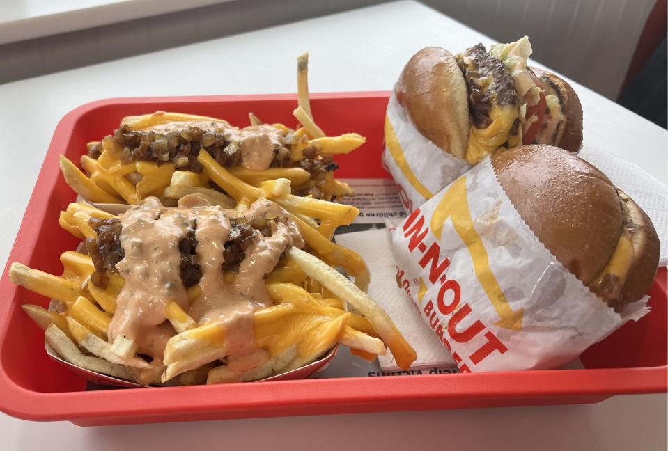 In-N-Out burgers plus fries with chopped chiles at the new Milton Road location in Flagstaff on opening day, Friday, April 5, 2024.