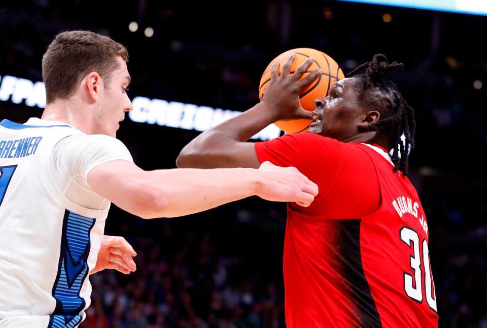 N.C. State’s D.J. Burns Jr. (30) works against Creighton’s Ryan Kalkbrenner (11) during the first half of N.C. State’s game against Creighton in the first round of the NCAA Tournament at Ball Arena in Denver, Colo., Friday, March 17, 2023. Ethan Hyman/ehyman@newsobserver.com