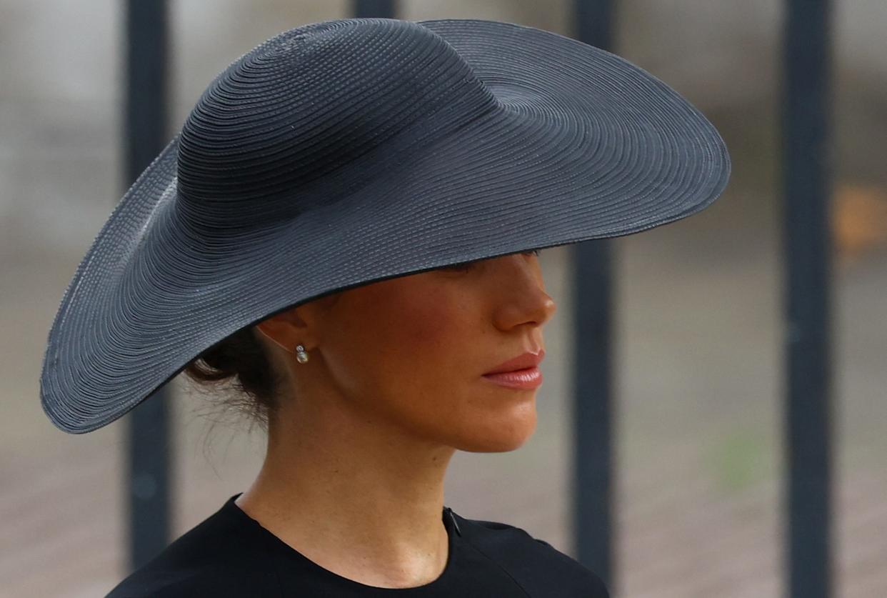 Duchess Meghan of Sussex walks outside Westminster Abbey on the day of the state funeral and burial of  Queen Elizabeth II, on Sept. 19, 2022 in London.