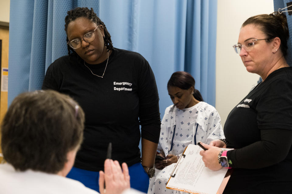 Students receive instructions through an examination during a role play exercise with Denishia Harris, center, during Sexual Assault Nurse Examiner training at Fayetteville State University (Cornell Watson for NBC News)