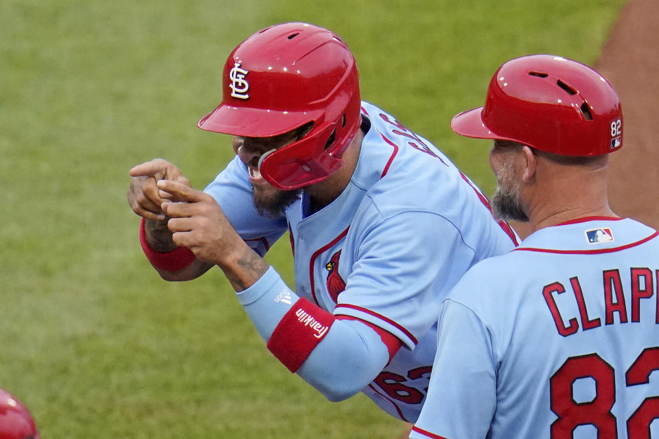 St. Louis Cardinals' Edmundo Sosa, left, celebrates after driving in a run with a single off Pittsburgh Pirates starting pitcher Jose Quintana during the second inning of a baseball game in Pittsburgh, Saturday, May 21, 2022. (AP Photo/Gene J. Puskar)