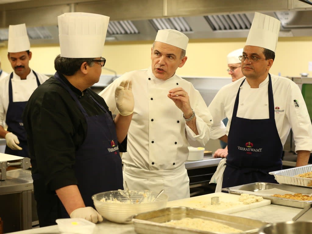Head Chef Mark Flanagan (centre) and chef Uday Salumkhe (left) in the kitchen at Buckingham Palace as they prepare food for a reception to mark the launch of the UK-India Year of Culture 2017 (Getty Images)