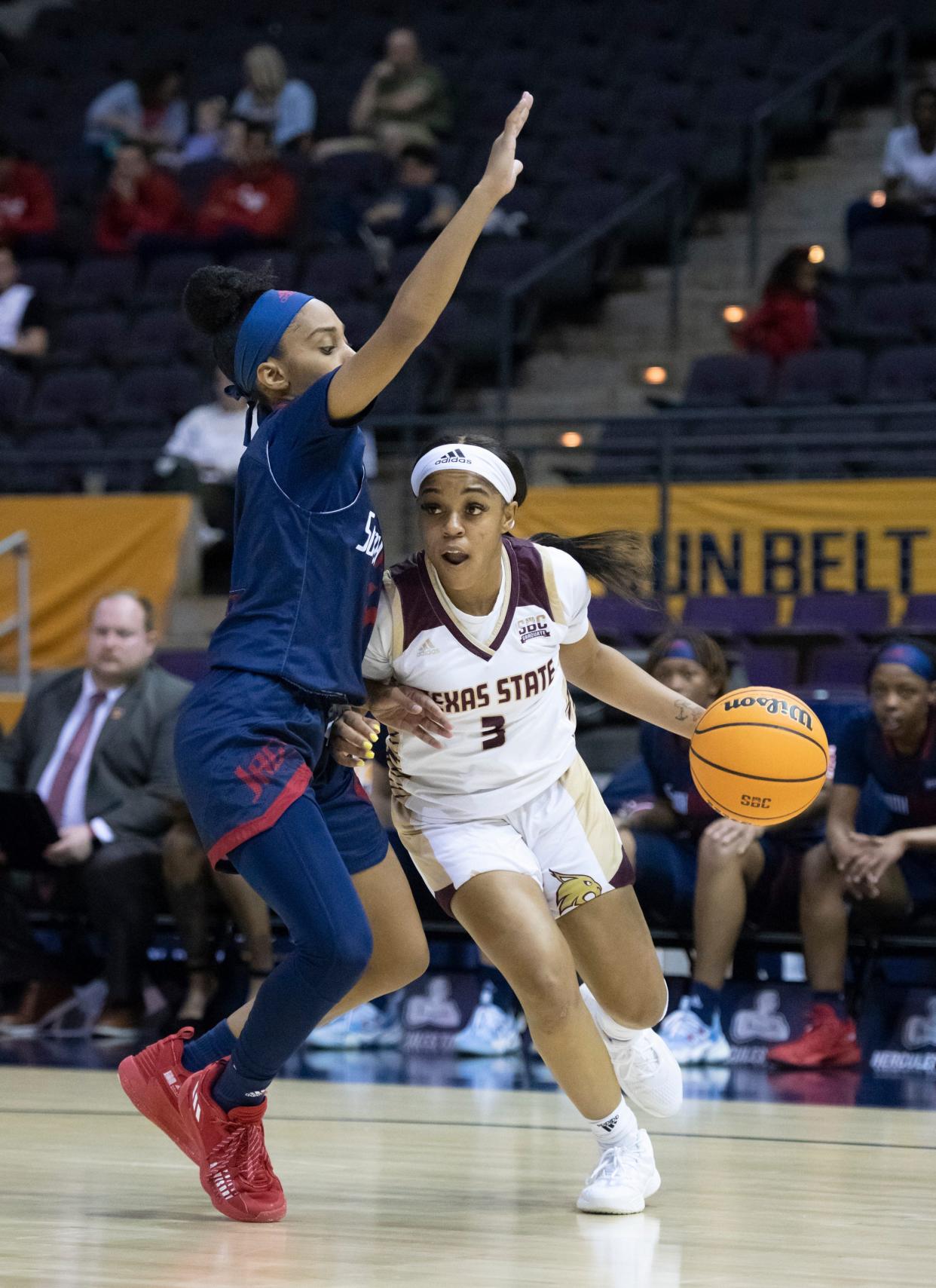 Texas State guard Kennedy Taylor, shown driving past a South Alabama defender during last year's Sun Belt tournament, had 11 assists against South Alabama last Saturday, moving her into the top spot on the Sun Belt's career assists list.