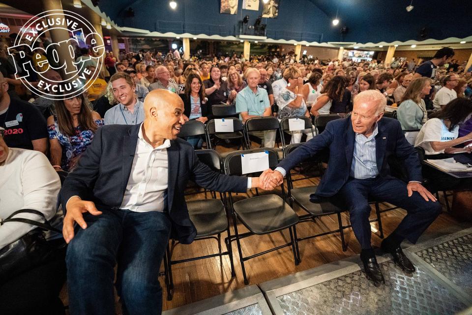Biden greets New Jersey Sen. <a href="https://people.com/tag/cory-booker/" rel="nofollow noopener" target="_blank" data-ylk="slk:Cory Booker;elm:context_link;itc:0;sec:content-canvas" class="link ">Cory Booker</a>, another 2020 presidential contender, at the Iowa Wing Ding Dinner in Clear Lake on Aug. 9, 2019.
