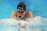 Lilly King participates in the women's 100 breaststroke during wave 2 of the U.S. Olympic Swim Trials on Tuesday, June 15, 2021, in Omaha, Neb. (AP Photo/Charlie Neibergall)